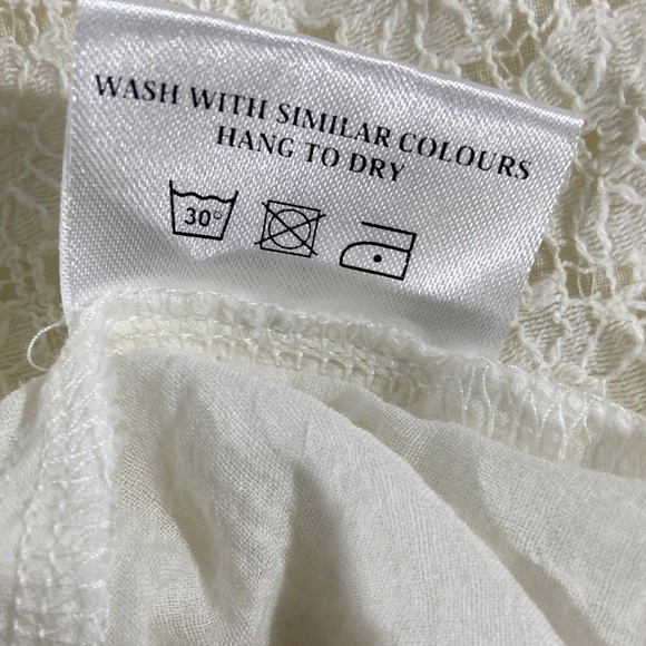 Elegant Cream Blouse with Flared Sleeves - Picture 11 of 11